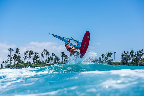 Duotone FreeWave windsurf board during wave riding at the tropical coastline of Maui, Hawaii