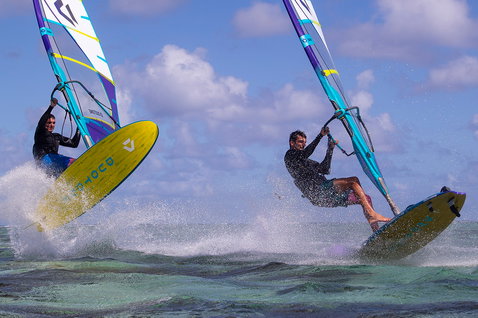 Duotone FreeWave SLS windsurf board during wave riding in a tropical ocean lagoon
