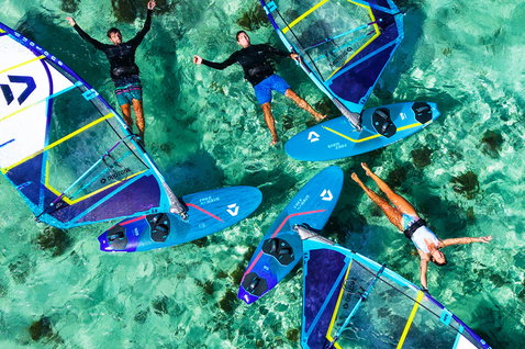 Duotone FreeWave SLS 2024 windsurf board during windsurfing in a tropical lagoon with turquoise water over reef
