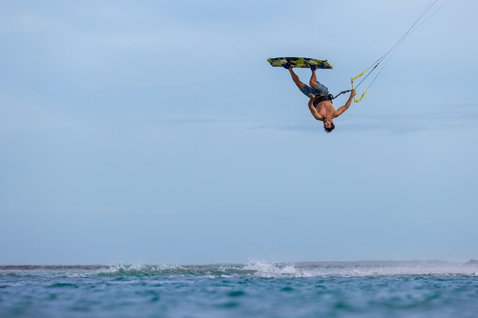 Duotone Jaime SLS twin-tip kiteboard during kitesurfing at an ocean beach