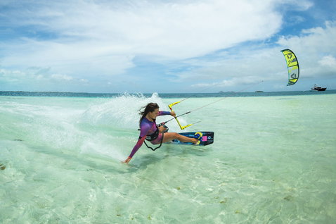 Duotone Soleil Concept Blue twin-tip kiteboard during kitesurfing in a tropical shallow ocean lagoon