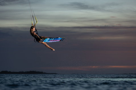 Duotone Soleil SLS twin-tip kiteboard during kitesurfing at the ocean beach