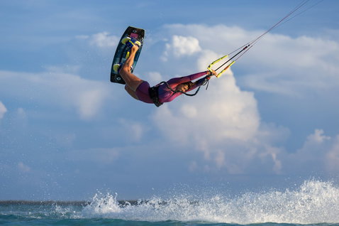Duotone Soleil SLS twin-tip kiteboard during kitesurfing on the ocean beach