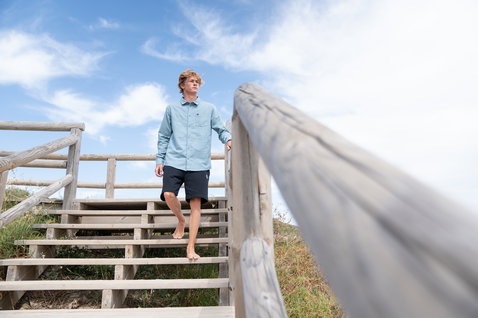 Duotone Apparel Breeze LS long sleeve shirt unisex worn at a coastal boardwalk