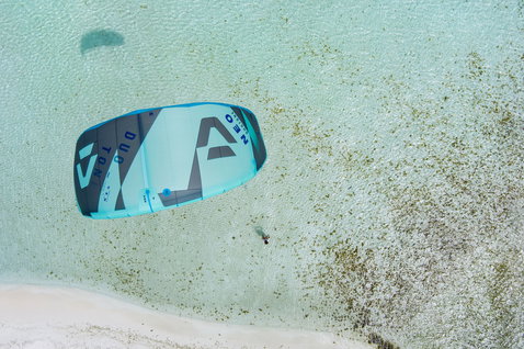 Duotone Neo LEI kite during wave riding in tropical shallow water at a sandy beach