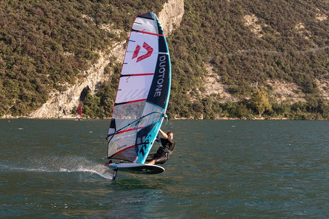 Duotone Warp Foil foil sail during wing foiling on a mountain lake