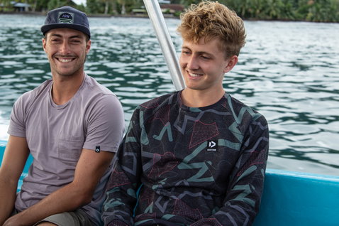 Duotone Sweater All Over men crew neck sweater during casual seated pose on boat in tropical coastal water