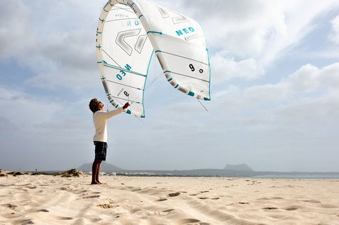 Duotone Neo Concept Blue LEI kite 9m during kitesurfing at an ocean beach