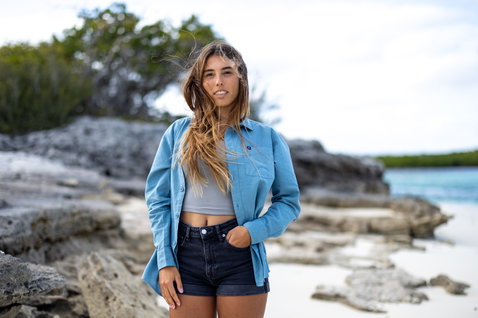 Duotone Apparel Shirt Breeze LS unisex long sleeve shirt in light blue during standing pose on an ocean beach