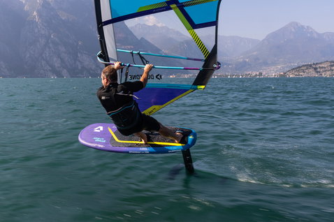 Duotone Stingray SLS windsurf board while foiling on an alpine lake