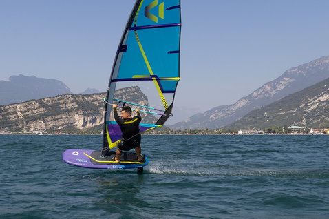 Duotone Stingray SLS windsurf board during windsurfing on a mountain lake