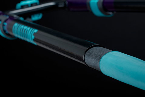Duotone Platinum Series SLS windsurf boom in near-black carbon with teal, purple and dark slate details