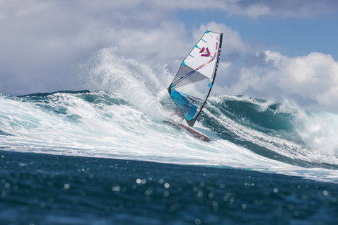 Duotone Super_Hero D/LAB wave sail during wave riding at an open ocean wave break