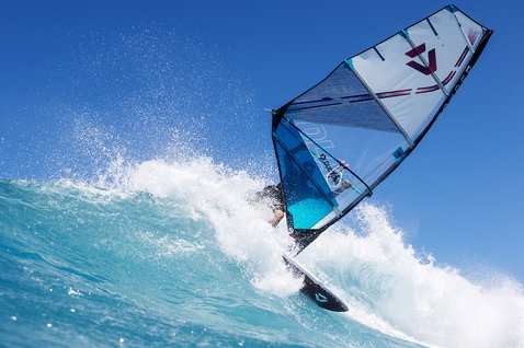 Duotone Super_Hero D/LAB wave sail during wave riding at an ocean beach