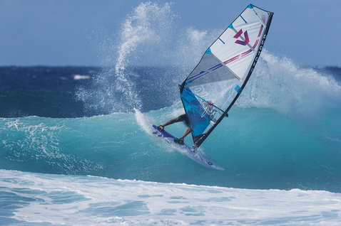 Duotone Super Hero D/LAB wave sail during wave riding at the ocean beach