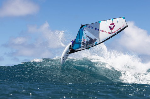 Duotone Super Hero D/LAB wave sail during wave riding at an open-water wave break
