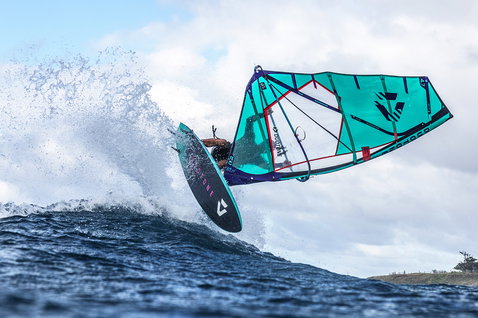 Duotone Grip 3 SLS windsurf board during wave riding at the ocean beach