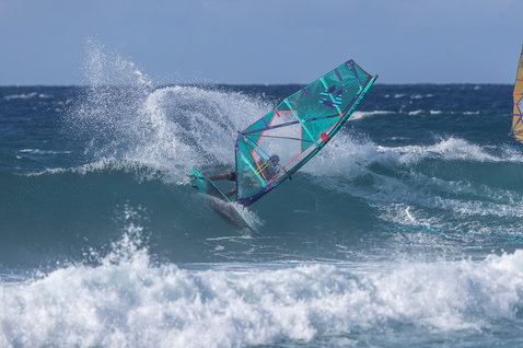 Duotone Grip 3 SLS windsurf board during wave riding at the ocean beach