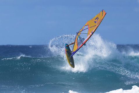 Duotone Grip 4 SLS windsurf board during wave riding at ocean beach
