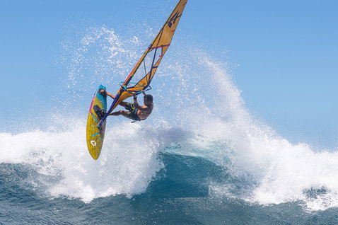 Duotone Grip 4 SLS windsurf board during wave riding in the ocean waves