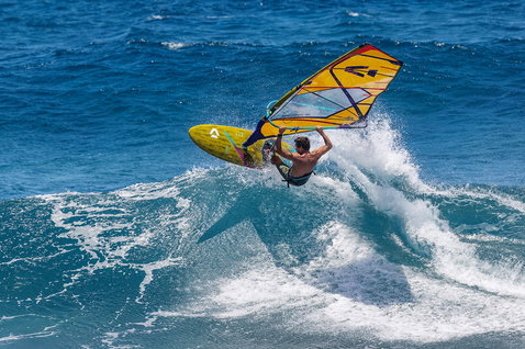 Duotone Grip 4 SLS windsurf board during wave riding in the ocean