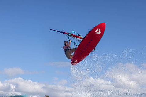 Duotone Ultra FreeWave windsurf board during wave riding at the ocean beach