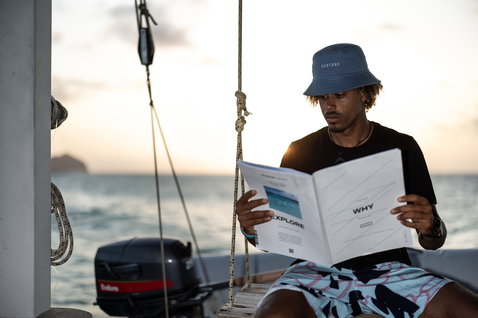 Bucket hat during casual reading on a boat on the ocean