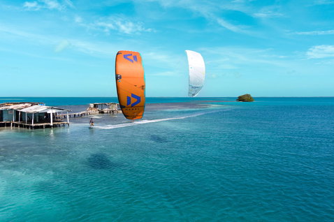 Duotone Rebel SLS Concept Blue 2025 LEI kite during kitesurfing in a tropical ocean lagoon