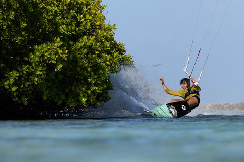 Duotone Rebel SLS Concept Blue LEI kite during kitesurfing at a tropical shallow-water lagoon with mangroves