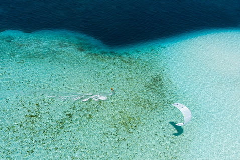 Duotone Rebel SLS Concept Blue LEI kite during kitesurfing in tropical lagoon