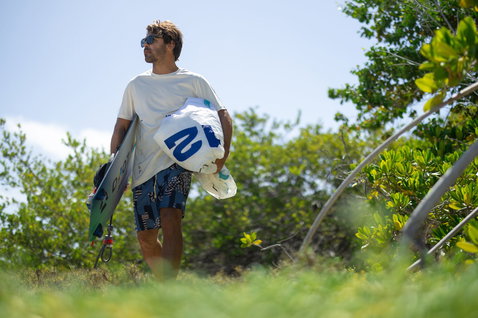 Duotone Rebel SLS LEI kite 12m during kitesurfing at a tropical coastal beach path