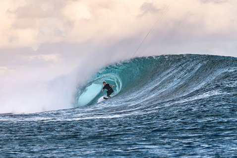 Team traction pad during wave riding in a barrelling ocean wave