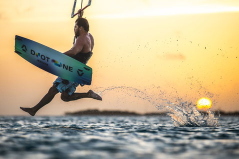 Duotone Jaime Concept Blue twin-tip kiteboard during kitesurfing at the ocean beach
