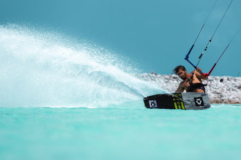 Duotone Select Concept Blue twin-tip kiteboard during kitesurfing in a tropical ocean lagoon