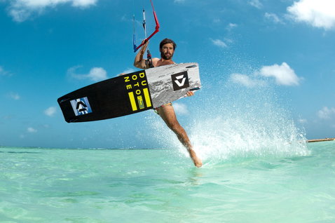 Duotone Select Concept Blue twin-tip kiteboard during kitesurfing on tropical flat water