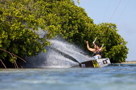 Duotone Select Concept Blue twin-tip kiteboard during kitesurfing in tropical lagoon with mangroves