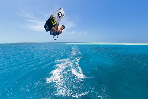 Duotone Select Concept Blue twin-tip kiteboard during kitesurfing in a tropical ocean lagoon