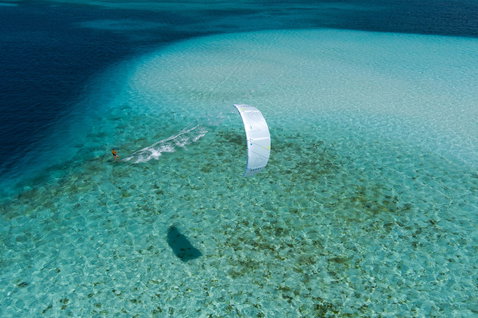 Duotone Select Concept Blue twin-tip kiteboard during kitesurfing in a tropical lagoon