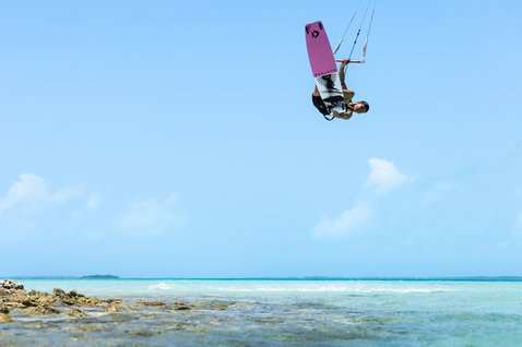 Duotone Soleil Concept Blue twin-tip kiteboard during kitesurfing at a tropical ocean beach