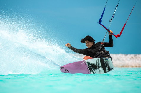 Duotone Soleil Concept Blue twin-tip kiteboard during kitesurfing on tropical flat water