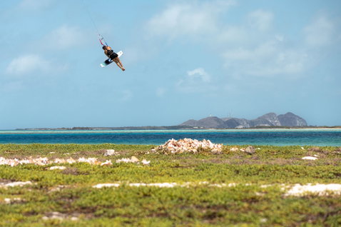 Duotone Soleil SLS twin-tip kiteboard during kitesurfing in a tropical coastal lagoon in Venezuela