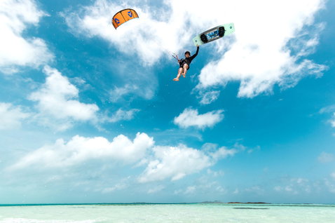Duotone Soleil SLS twin-tip kiteboard during kitesurfing in a tropical ocean lagoon