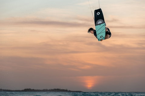 Duotone Soleil SLS twin-tip kiteboard during kitesurfing at an ocean beach
