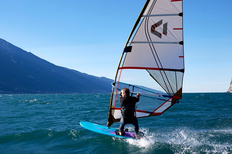 Duotone Blast windsurf board windsurfing on an alpine lake