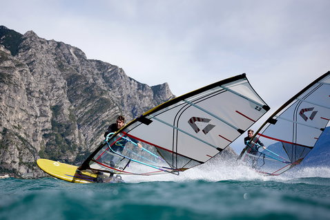 Duotone Blast SLS windsurf board during windsurfing on a mountain lake