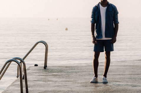 Duotone Apparel Shirt LS True long sleeve shirt during standing pose on a coastal pier by the sea in blue horizon