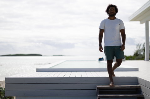 Duotone Apparel Tee Pocket SS Concept Blue short sleeve t-shirt for men in undyed natural off-white on a luxury oceanside deck