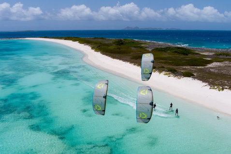 Duotone Spike D/LAB LEI kite during kitesurfing at a tropical beach lagoon