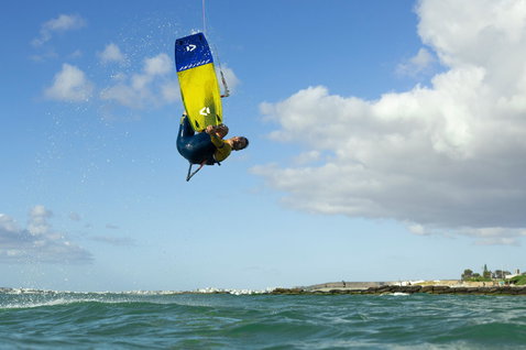 Duotone Spike SLS twin-tip kiteboard during kitesurfing on the coast of Cape Town