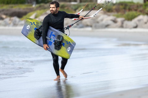 Duotone Spike SLS twin-tip kiteboard during kitesurfing at the beach of Cape Town